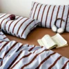 S63f682aff2774df9ab546cc67edfeae90.webp 3pcs Simple Pink Striped Duvet Cover Set